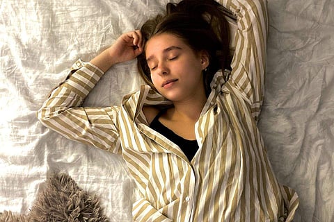 Create a sleep-conducive environment, ensuring a quiet, dark, and cool bedroom