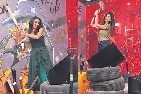 Models Amisha & Sainna Boopathy enjoy some 'whack' time at the Rage Room at Medavakkam. Pics: Shiba Prasad Sahu