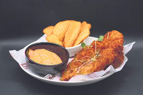 Crumb fried chicken schnitzel, potato wedges