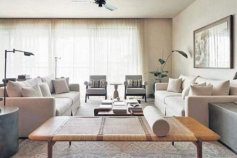 In situ image of a Tangali bench and two upholstered easy arm chairs