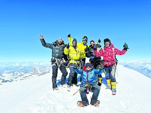 The team at the summit of Mount Kun Expedition