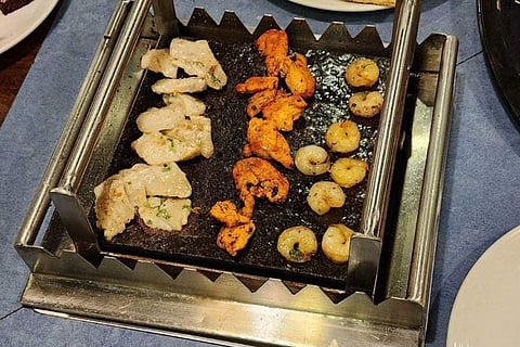 Starters being cooked on stone