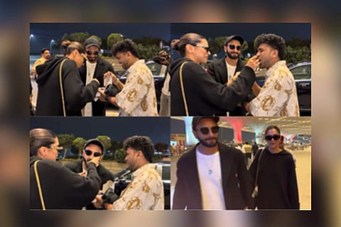 Deepika Padukone and Ranveer Singh celebrating with the paparazzo