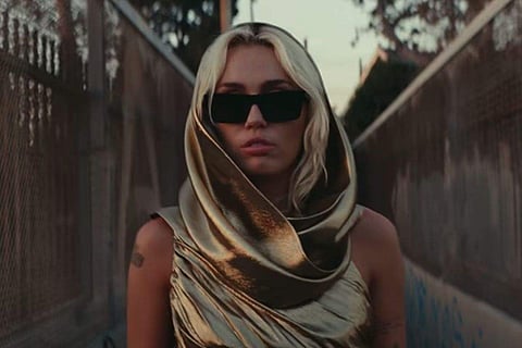 Miley Cyrus in a scene from the music video of 'Flowers'