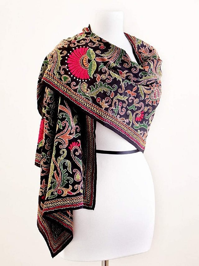 <em>A black kantha scarf with multi-coloured embroidery</em>