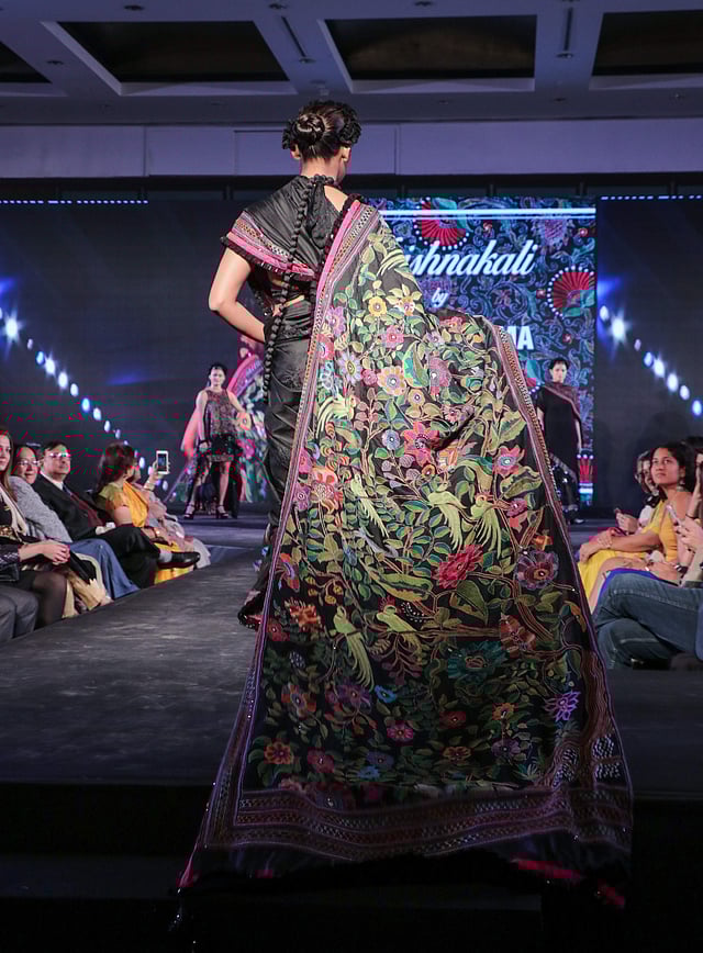 <em>A close-up of an elaborate kantha embroidered saree</em>