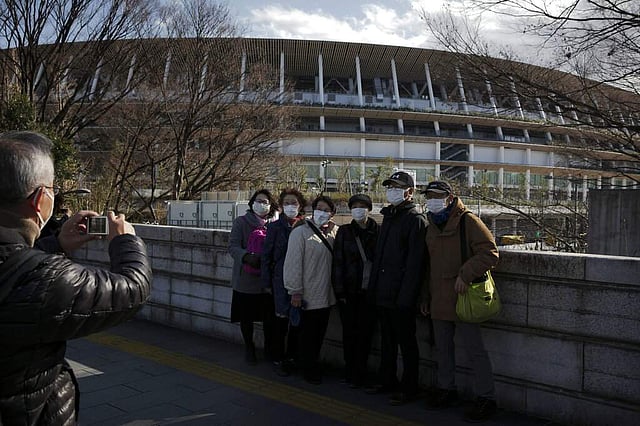 <em>Tourists at New National Stadium, Tokyo (AP Photo/Jae C Hong)</em>