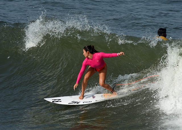 <em>A surfer riding the waves</em>
