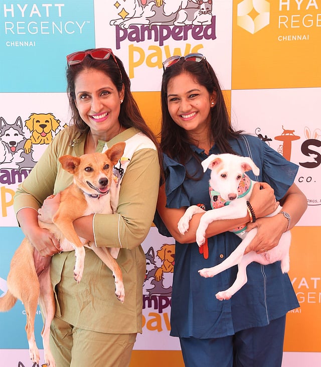 <em>Kavitha & Renu with their pooches at the pet carnival</em>