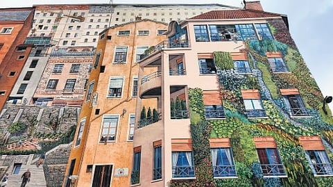 In frame: A mural painted on the wall of the Boulevard des Canuts