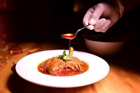 Pora Moshla Murgi curry