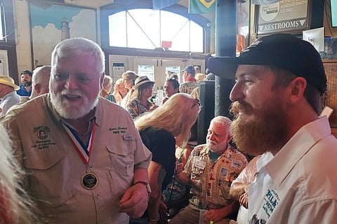 Stephen Hemingway Adams (right), a great-grandson of Ernest Hemingway, speaks with 2023 Hemingway Look-Alike Contest winner Gerrit Marshall at Sloppy Joe's Bar in Key West, Florida (July 17)