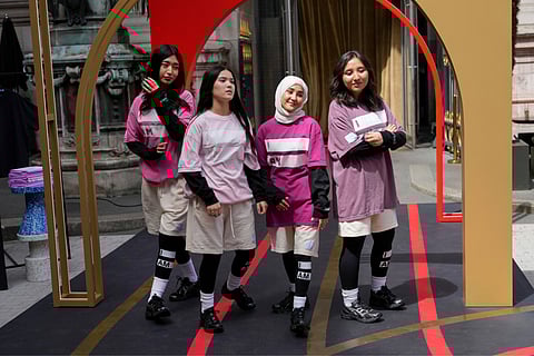 Ayenda formally known as Afghanistan youth, wear creations by 4TheWalk and Sneex footwear, during the first gender equal Olympic Games fashion show, at the 2024 Summer Olympics in Paris, Sunday (July 28) To celebrate gender equality at the Olympics, PARITY Paris hosted a runway show in conjunction with the Coca-Cola House