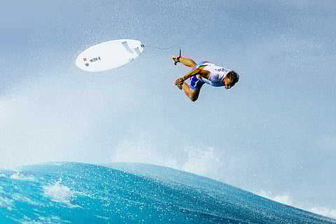 Kauli Vaast, of France, falls into the water on a training day ahead of the 2024 Summer Olympics surfing competition (July 23) in Teahupo'o, Tahiti