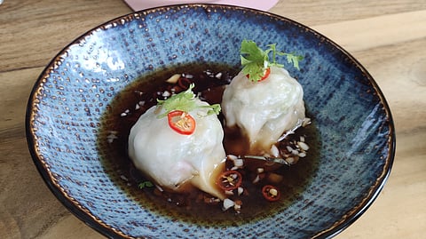 In frame: Poached Vegetable Dumplings