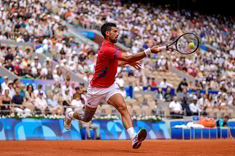 Serbia's Novak Djokovic returns the ball against Germany's Dominik Koepfer during the men's single tennis competition at the Roland Garros stadium at the 2024 Summer Olympics (July 31) in Paris, France
