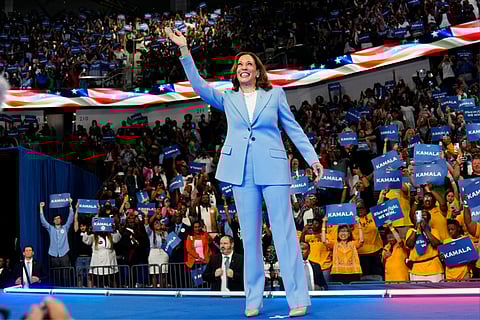 Vice President Kamala Harris waves during a campaign rally (July 30) in Atlanta