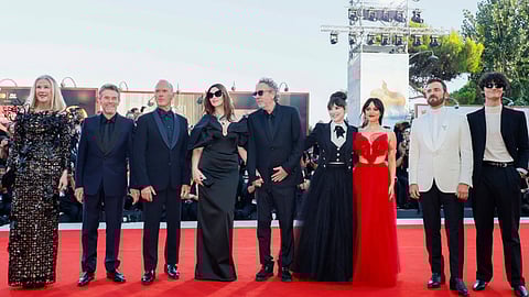 Catherine O'Hara, from left, Willem Dafoe, Michael Keaton, Monica Bellucci, director Tim Burton, Winona Ryder, Jenna Ortega, Justin Theroux and Arthur Conti pose for photographers upon arrival for the premiere of the film Beetlejuice Beetlejuice
