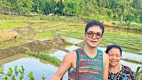 Jenjum Gadi with his mother in her garden