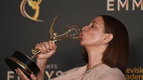 Maya Rudolph kisses her trophy for outstanding character voice-over performance on Big Mouth