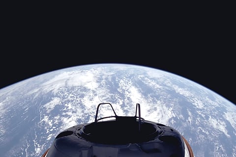 This image provided by SpaceX on Sept. 10, 2024, shows a view of Earth and the Dragon capsule's Skywalker spacewalk platform shortly after the Polaris Dawn crew launched into an orbit