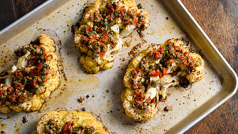 Cauliflower steaks with pickled peppers, capers and parmesan