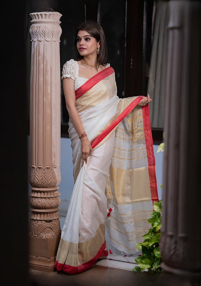 Wide border linen sari in ivory and red with gold zari