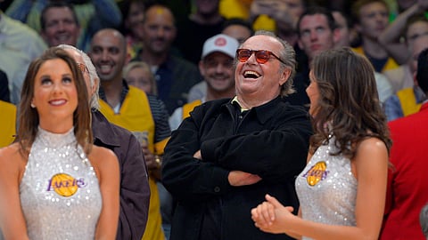 Actor Jack Nicholson laughs at former Los Angeles Lakers center Shaquille O'Neal as they retire his jersey during halftime of the Lakers' NBA basketball game