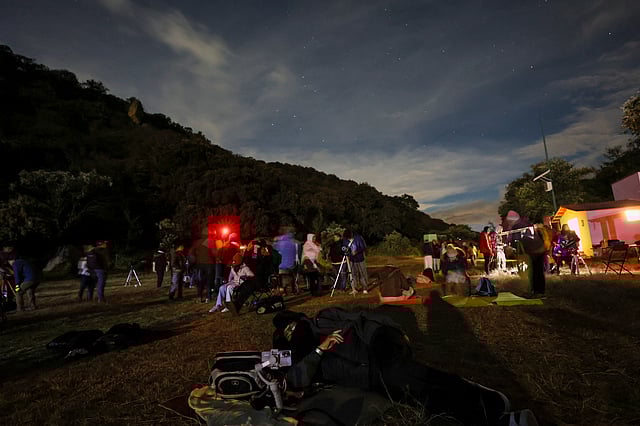 People attend a stargazing and comet-watching gathering at Joya-La Barreta ecological park