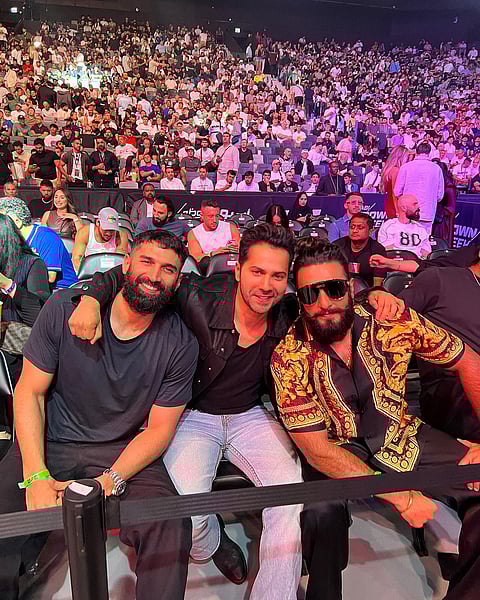 Allu Arjun (L); David Warner (R)