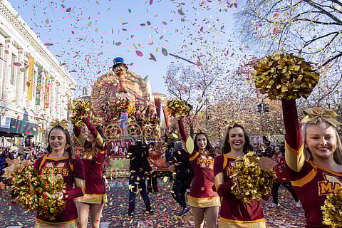 FILE - Performers lead the Tom Turkey float down Central Park West at the start of the Macy's Thanksgiving Day parade on Nov. 23, 2023, in New York