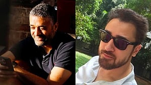 Danish Aslam (L) and Imran Khan