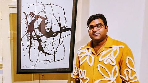 Artist Rohitendra Chandra Deb with his artwork