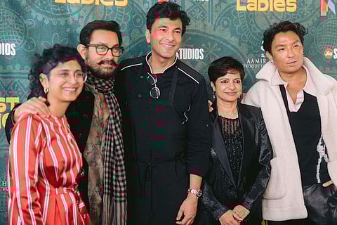 Richard Curtis, from left, Michael G. Wilson, Juliet Taylor, Martina Jones, Rashida Jones, Kenya Kinski-Jones, Quincy Jones III, and Barbara BroccolADi pose with their awards during the 15th Governors Awards on Sunday, Nov. 17, 2024, at The Ray Dolby Ballroom in Los Angeles. 