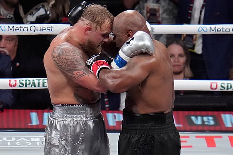 Jake Paul and Mike Tyson embrace after their heavyweight boxing match, Friday, Nov. 15, 2024, in Arlington, Texas.