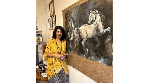 Sujata Dere with her artwork
