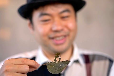 In Frames: A Japanese artist finds solace and global fans with intricate leaf-cutting