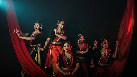 Bimbavati Devi (wearing a red garland) with her troupe