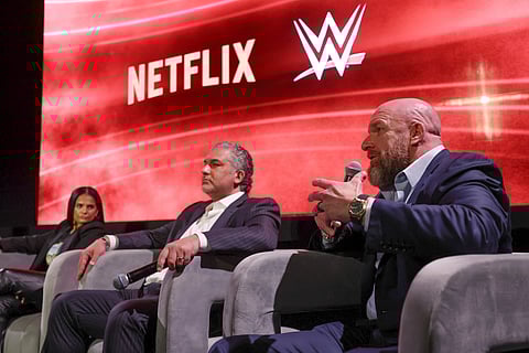 From left, Netflix Chief Content Officer Bela Bajaria, WWE President Nick Khan and WWE Chief Content Officer Paul "Triple H" Levesque discuss the World Wrestling Entertainment and Netflix during an event at Netflix's headquarters in Los Angeles on Dec. 3, 2024