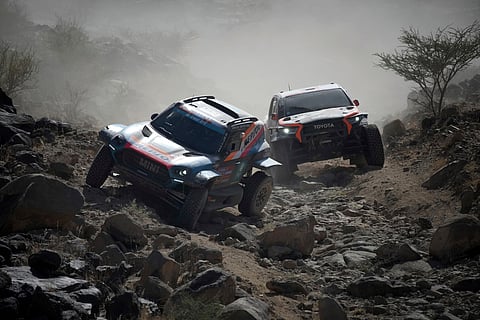 Driver Joao Ferreira and co-driver Filipe Palmeiro in the left car compete during stage one of the Dakar Rally with start and finish in Bisha, Saudi Arabia, Saturday, Jan. 4, 2025