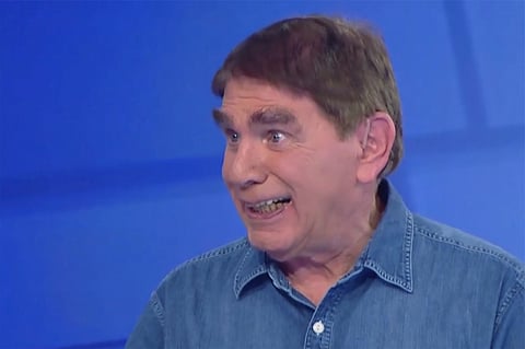 In this frame grab taken from video provided by CHANNEL 12 NEWS, Israeli journalist Moshe Nussbaum whose speech is impaired due to ALS (amyotrophic lateral sclerosis), talks in a studio, Neve Ilan, Israel, on Dec. 28, 2024