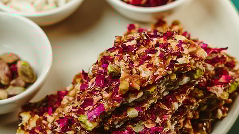 Jaggery chikkis garnished with rose petals 