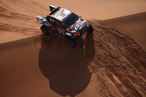 Driver Henk Lategan and co-driver Brett Cummings compete during the eighth stage of the Dakar Rally between Al Duwadimi and Riyadh, Saudi Arabia, Monday, Jan. 13, 2025