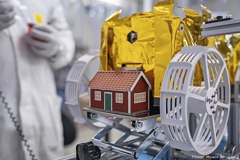 A little red model house created by artist Mikael Genberg and scheduled to launch into space on a Falcon 9 rocket from Cape Canaveral in Florida on Wednesday, Jan. 15, 2025