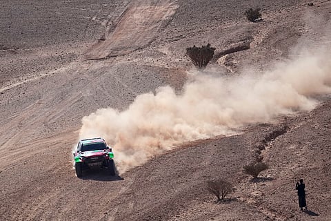 Driver Yazeed Al Rajhi and co-driver Timo Gottschalk compete during the ninth stage of the Dakar Rally between Riyadh and Haradh, Saudi Arabia, Tuesday, Jan. 14, 2025