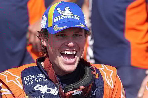 Rider Daniel Sanders of Australia celebrates winning the Dakar Rally after the twelfth stage in Shubaytah, Saudi Arabia, Friday, Jan. 17, 2025
