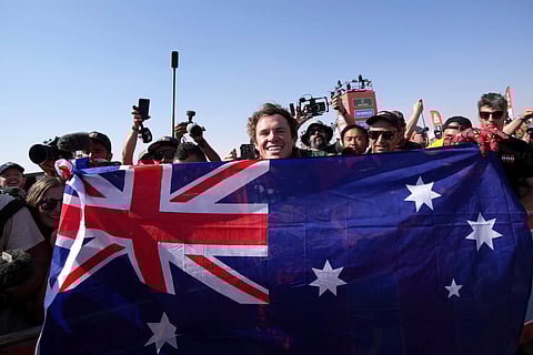 Rider Daniel Sanders of Australia celebrates winning the Dakar Rally after the twelfth stage in Shubaytah, Saudi Arabia, Friday, Jan. 17, 2025.