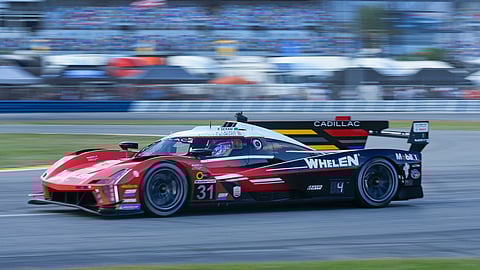 FILE - Tom Blomqvist, of Britain, drives the Cadillac V-Series R through a turn during a practice session for the Rolex 24 hour auto race at Daytona International Speedway, Jan. 25, 2024, in Daytona Beach, Florida
