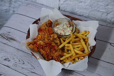 Peri peri chicken strips with fries