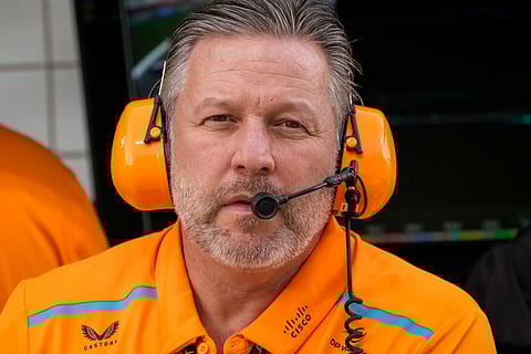 FILE - McLaren chief Zak Brown looks at the garages during a Formula One preseason test at the Bahrain International Circuit in Sakhir, Bahrain, Feb. 23, 2024